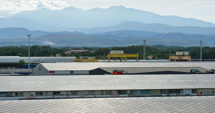 Roof landscape of Saint Charles Solaire in Perpignan during the day. In the background mountains are visible.
