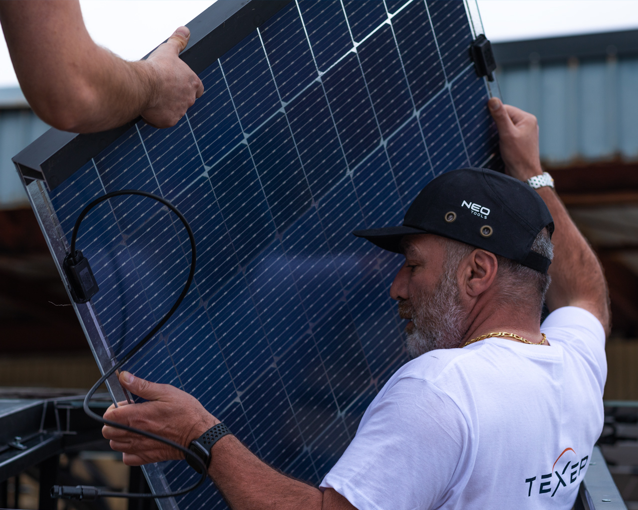 Serge Bosca mounting solar modules onto the roof of the Aquaviva station